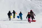 Luge-enfants-©Guillaume-Grasset-Office-de-Tourisme-de-Pralognan-la-Vanoise.webp