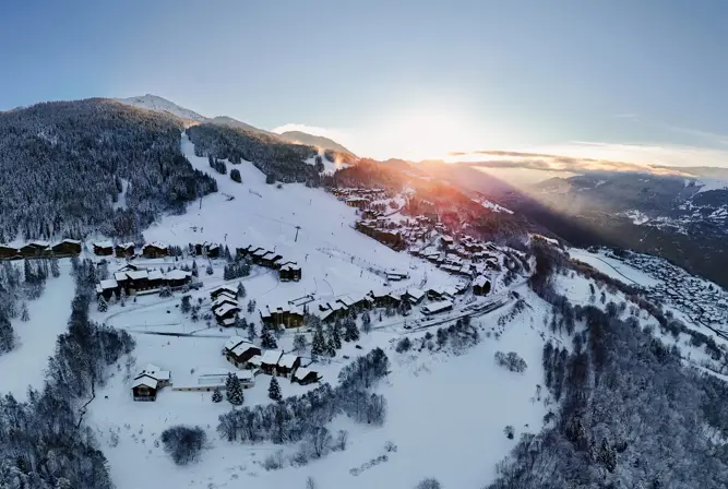 Montalbert sunrise whole village view credit BrendanLePeru-La_Plagne
