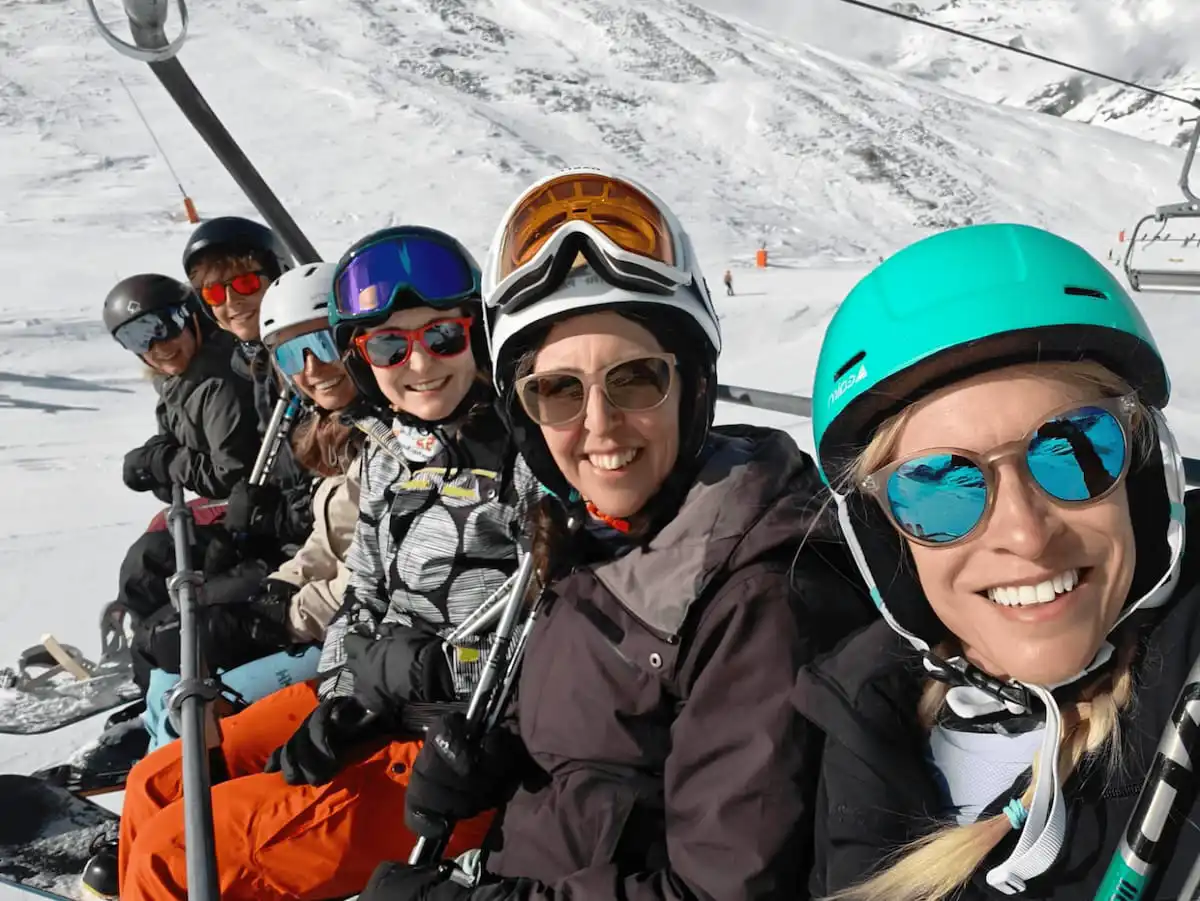 Peak Retreats Team Members On Chairlift In Tignes