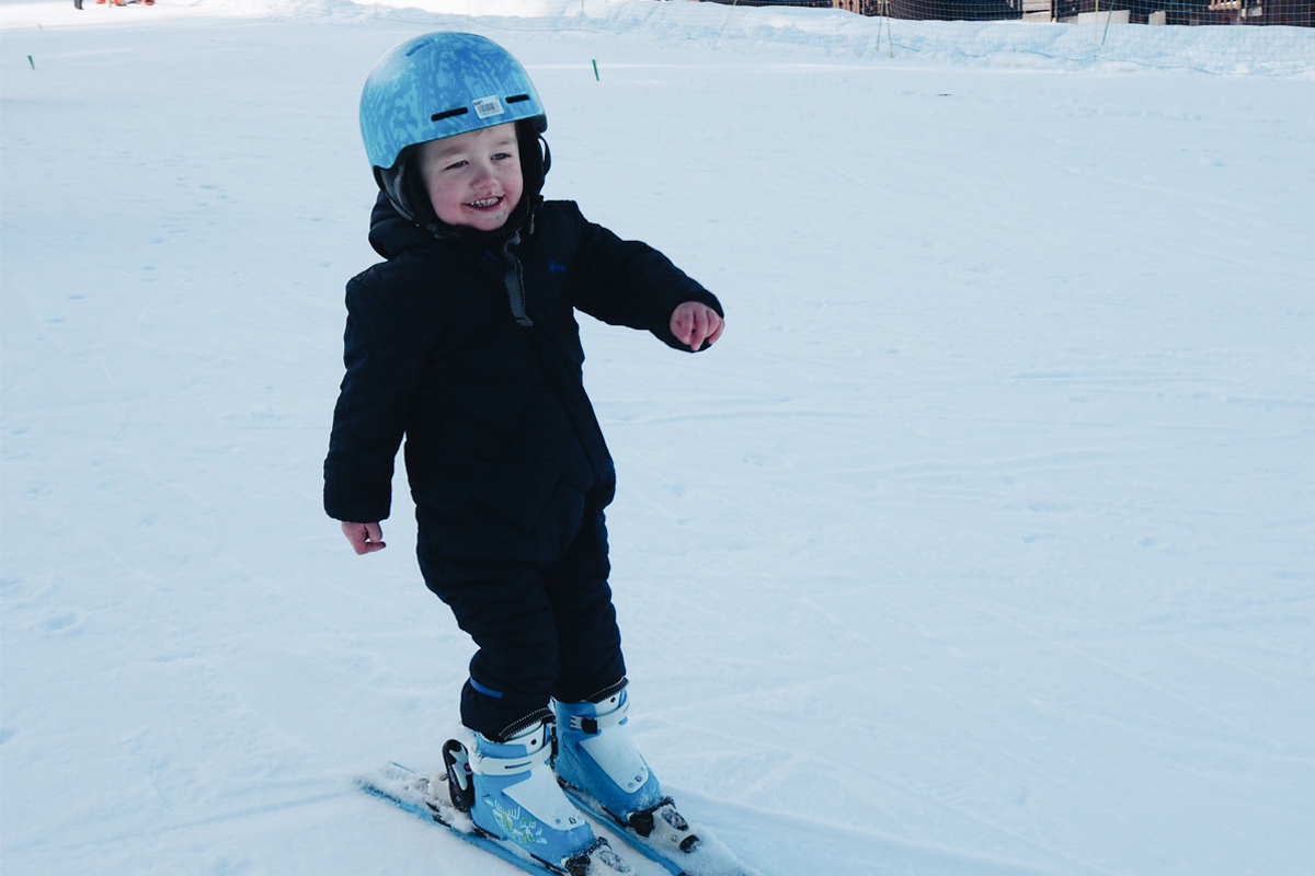 Family skiing in Valmorel: Their child enjoying skiing on his own