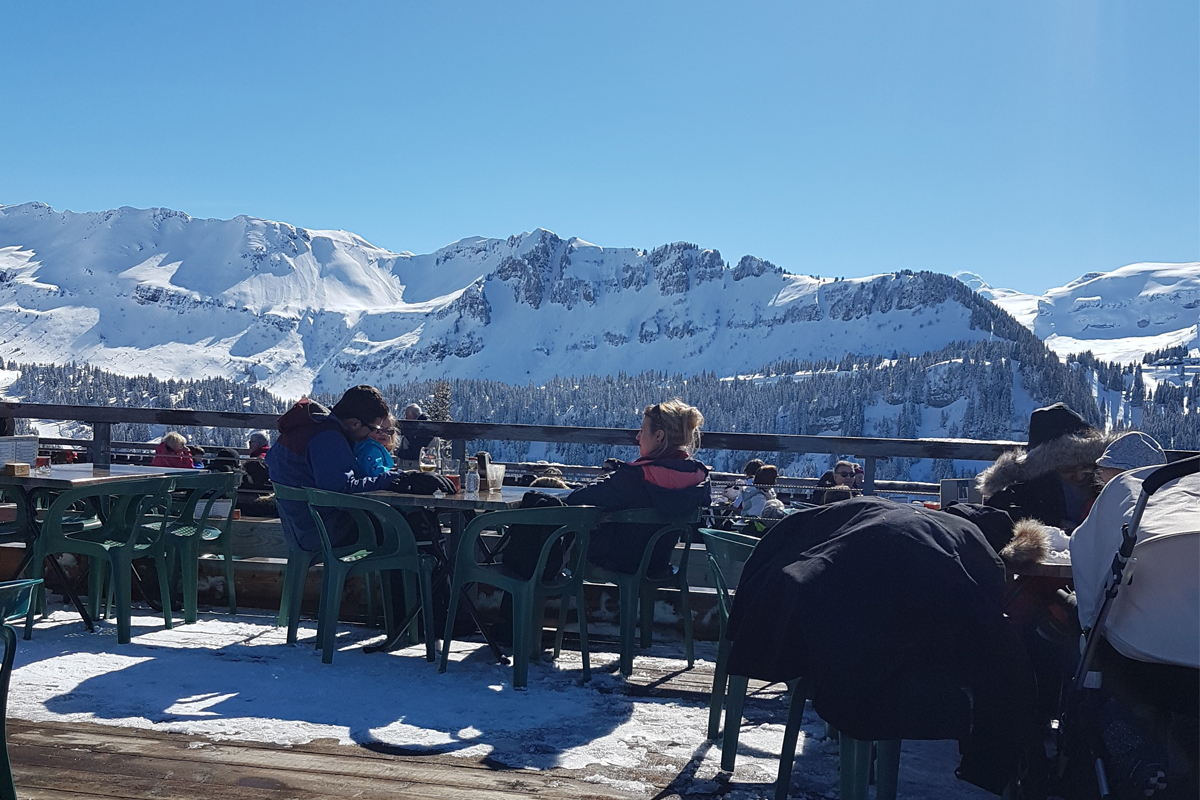 Enjoying the sun terrace on the slopes in Les Carroz, Grand Massif