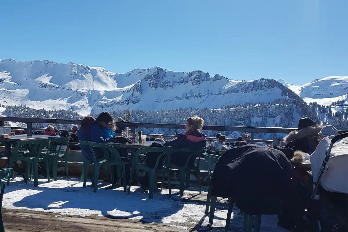 Enjoying the sun terrace on the slopes in Les Carroz, Grand Massif