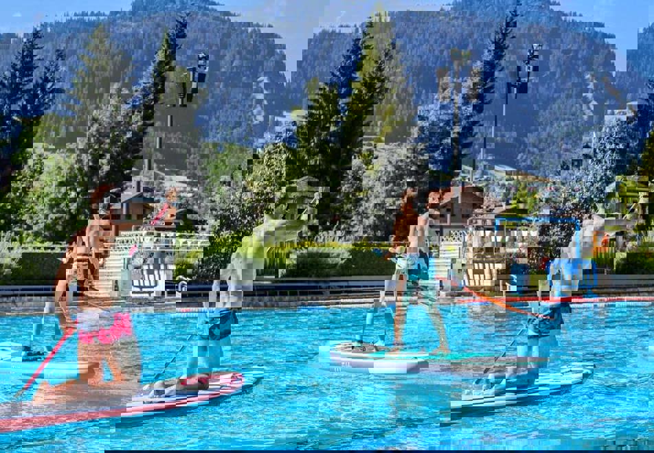 Paddleboarding on the outdoor pool in Megeve