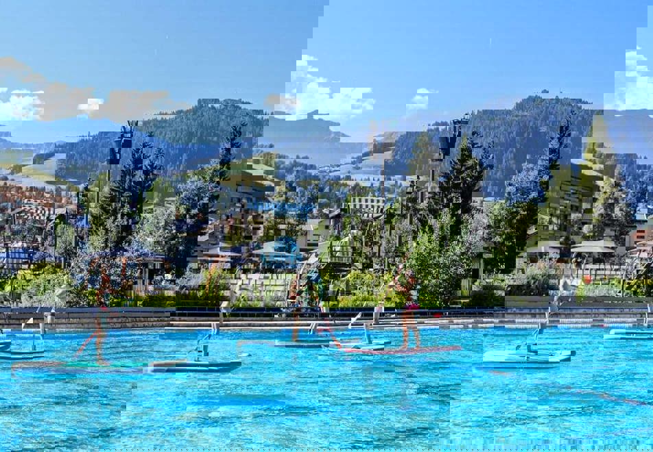 Paddleboarding on the outdoor pool in Megeve