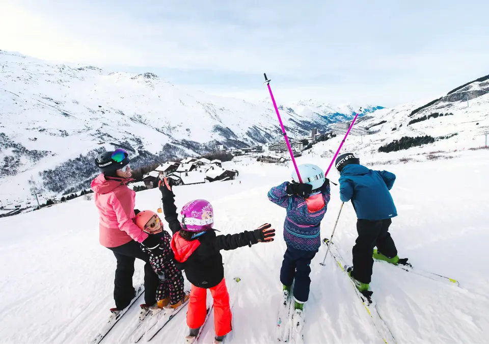 Les Menuires ski resort family skiing above resort David_ANDRE
