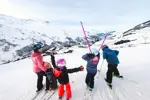 Les Menuires ski resort family skiing above resort David_ANDRE